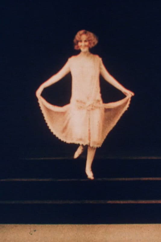 Poster backdrop for Colourful Fashions from Paris